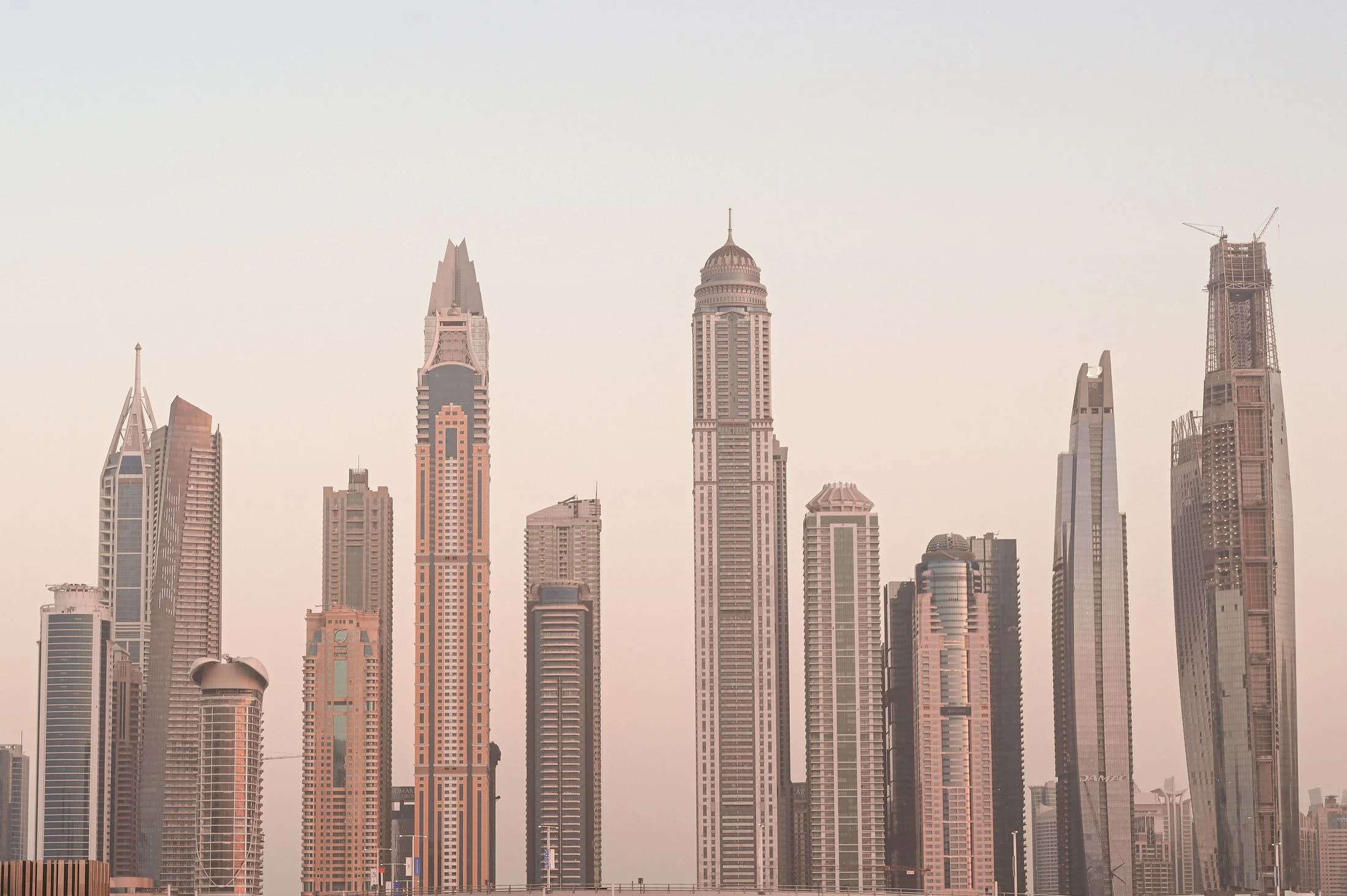 Dubai Marina skyline at dusk, with towers along the waterfront